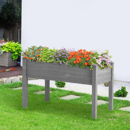 Outdoor wooden raised garden bed with legs